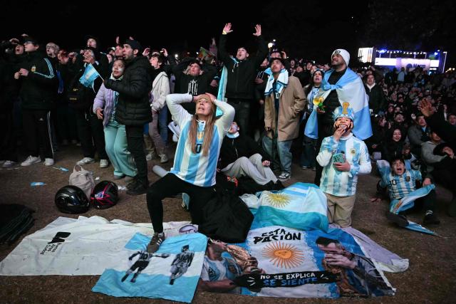 Argentina supporters react while watching the 2026 FIFA World Cup Round of 32 football match between Argentina and Cape Verde on a giant screen in Buenos Aires on July 3, 2026. (Photo by Luis ROBAYO / AFP)