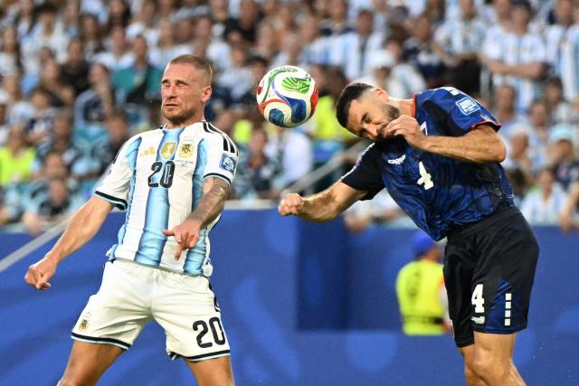 Argentina's midfielder #20 Alexis Mac Allister and Cape Verde's defender #04 Pico Lopes fight for the ball during the 2026 World Cup round of 32 football match between Argentina and Cape Verde at the Miami Stadium in Miami Gardens on July 3, 2026.  (Photo by ROBERTO SCHMIDT / AFP)