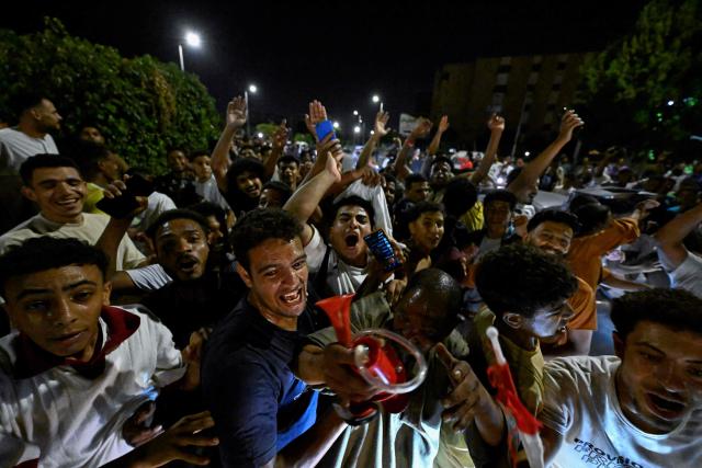 Egyptian fans celebrate their team's victory in the 2026 World Cup Round of 32 football match against Australia in Al-Shorouk City, east of Cairo, on July 4, 2026. (Photo by Khaled DESOUKI / AFP)