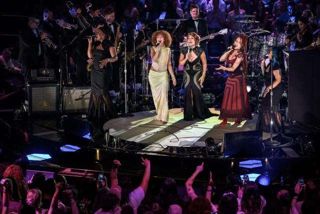Britain's singer-songwriter Raye (C) performs with her sisters Amma (L) and Absolutely during the opening day of the 60th Montreux Jazz Festival, in Montreux on July 3, 2026. (Photo by Fabrice COFFRINI / AFP)