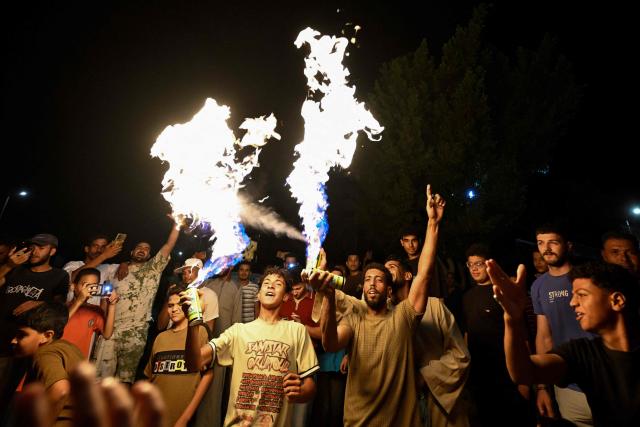 Egyptian fans celebrate their team's victory in the 2026 World Cup Round of 32 football match against Australia in Al-Shorouk City, east of Cairo, on July 4, 2026. (Photo by Khaled DESOUKI / AFP)