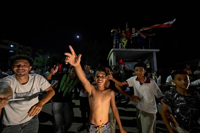 Egyptian fans celebrate their team's victory in the 2026 World Cup Round of 32 football match against Australia in Al-Shorouk City, east of Cairo, on July 4, 2026. (Photo by Khaled DESOUKI / AFP)