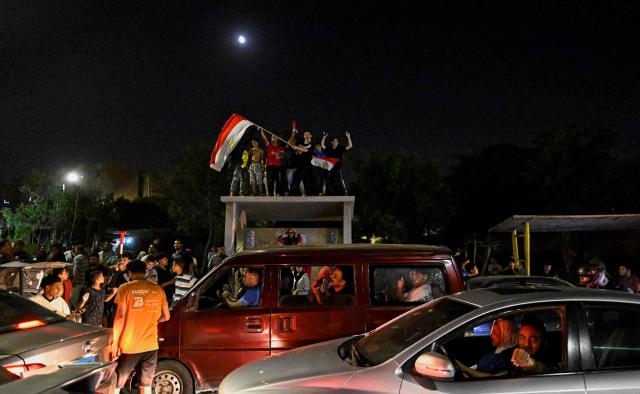 Egyptian fans celebrate their team's victory in the 2026 World Cup Round of 32 football match against Australia in Al-Shorouk City, east of Cairo, on July 4, 2026. (Photo by Khaled DESOUKI / AFP)