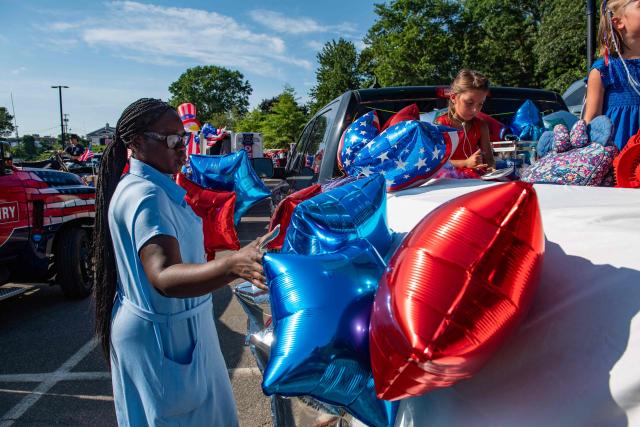People decorate their float before the start of the Gloucester Fishtown Horribles Parade in Gloucester, Massachusetts on July 3, 2026. The parade is part of the city’s July 4th celebrations. (Photo by JOSEPH PREZIOSO / AFP)