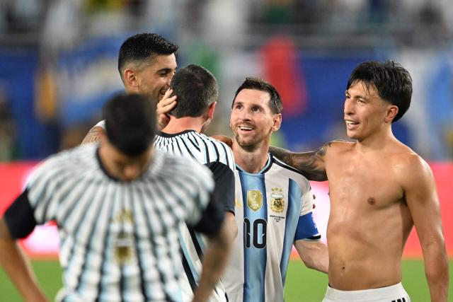 Argentina's forward #10 Lionel Messi celebrates with Argentina's defender #06 Lisandro Martinez after winning the 2026 World Cup round of 32 football match between Argentina and Cape Verde at the Miami Stadium in Miami Gardens on July 3, 2026.  (Photo by ROBERTO SCHMIDT / AFP)