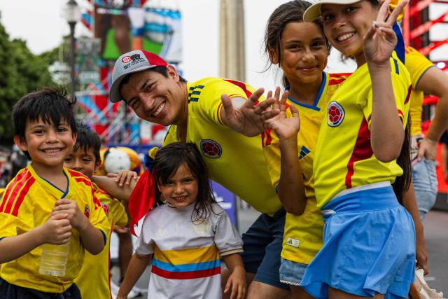 Colombia fans pose for a picture at the FIFA Fan Festival as they wait for the WC 2026 Round of 32 match between Colombia and Ghana in Kansas City, Missouri on July 3, 2026. (Photo by Austin Johnson / AFP)