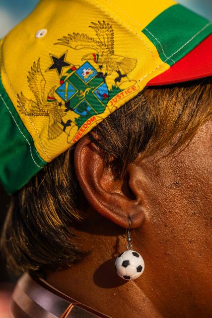 A Ghana fan wears a soccer nall earing at the FIFA Fan Festival as they wait for the WC 2026 Round of 32 match between Colombia and Ghana in Kansas City, Missouri on July 3, 2026. (Photo by Austin Johnson / AFP)