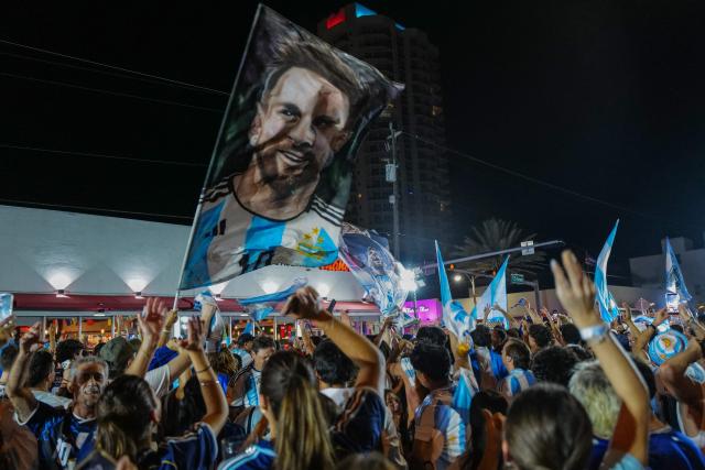Argentina fans wave a Messi flag as they celebrate their team's victory in the 2026 World Cup Round of 32 football match against Cape Verde in Miami Beach, Florida, on July 3, 2026. (Photo by Giorgio VIERA / AFP)