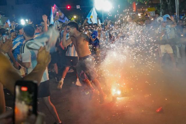 Argentina fans celebrate their team's victory in the 2026 World Cup Round of 32 football match against Cape Verde in Miami Beach, Florida, on July 3, 2026. (Photo by Giorgio VIERA / AFP)