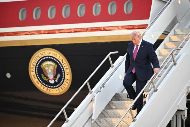 US President Donald Trump steps off Air Force One upon arrival at Ellesworth Air Force Base in South Dakota on July 3, 2026. Trump is heading to South Dakota where he will deliver remarks at Mt. Rushmore. (Photo by Mandel NGAN / AFP)