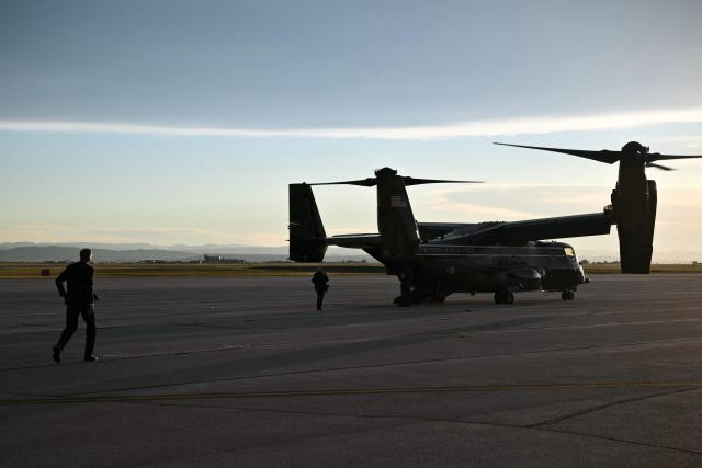 US Senate Majority Leader John Thune (L), Republican from South Dakota, walks to board an Osprey aircraft at Ellsworth Air Force Base, South Dakota on July 3, 2026. Thune will join Donald Trump where he will deliver remarks at Mt. Rushmore. (Photo by Mandel NGAN / AFP)