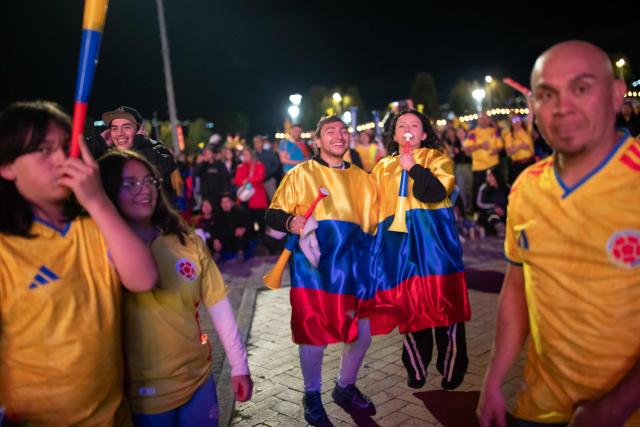 Colombia football fans cheer while watching the 2026 FIFA World Cup round of 32 match between Colombia and Ghana on a giant screen in Bogota on July 3, 2026. (Photo by ESTEBAN VEGA LA-ROTTA / AFP)