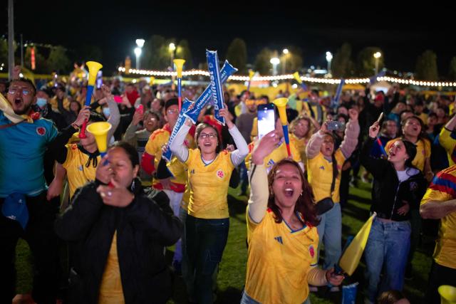 Colombia football fans cheer while watching the 2026 FIFA World Cup round of 32 match between Colombia and Ghana on a giant screen in Bogota on July 3, 2026. (Photo by ESTEBAN VEGA LA-ROTTA / AFP)