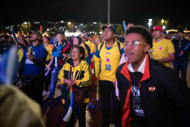 Colombia football fans react while watching the 2026 FIFA World Cup round of 32 match between Colombia and Ghana on a giant screen in Bogota on July 3, 2026. (Photo by ESTEBAN VEGA LA-ROTTA / AFP)