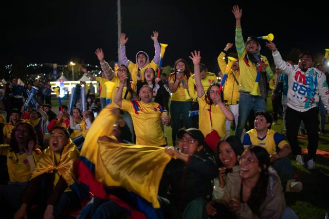 Colombia football fans cheer while watching the 2026 FIFA World Cup round of 32 match between Colombia and Ghana on a giant screen in Bogota on July 3, 2026. (Photo by ESTEBAN VEGA LA-ROTTA / AFP)