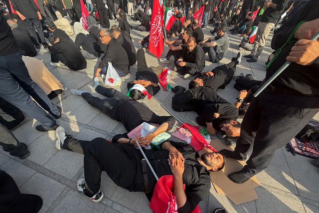 Mourners gather at the Grand Mosalla to pay their final respects to Iran's slain supreme leader Ayatollah Ali Khamenei at the start of his funeral ceremonies in Tehran on July 4, 2026. Iran officially began on July 4 morning six days of public funeral ceremonies for late supreme leader Ayatollah Ali Khamenei, state television reported, with processions due to continue in Iraq before his burial. (Photo by Atta KENARE / AFP) / 