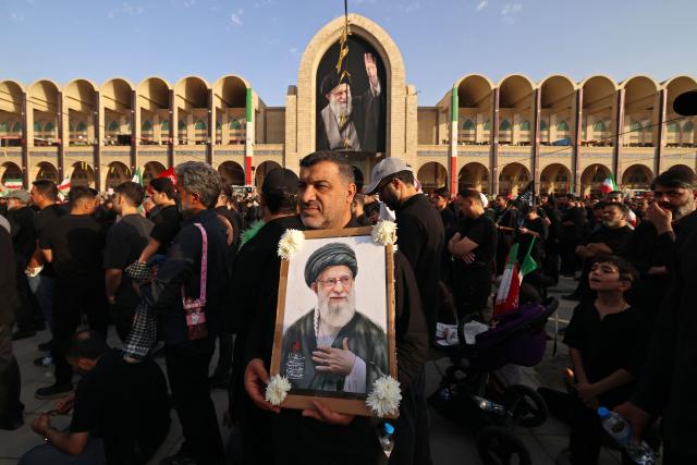 Mourners gather at the Grand Mosalla to pay their final respects to Iran's slain supreme leader Ayatollah Ali Khamenei at the start of his funeral ceremonies in Tehran on July 4, 2026. Iran officially began on July 4 morning six days of public funeral ceremonies for late supreme leader Ayatollah Ali Khamenei, state television reported, with processions due to continue in Iraq before his burial. (Photo by Atta KENARE / AFP) / 