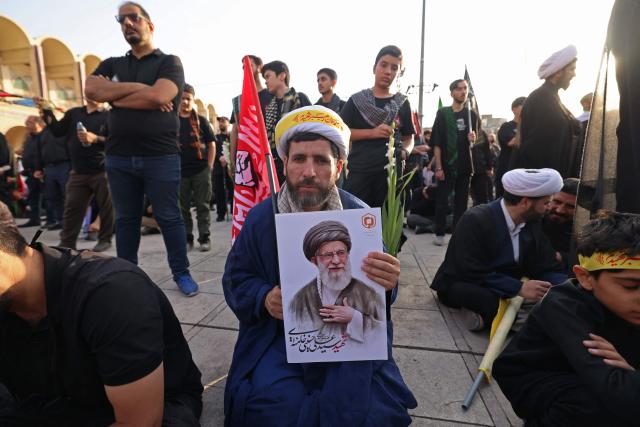 Mourners gather at the Grand Mosalla to pay their final respects to Iran's slain supreme leader Ayatollah Ali Khamenei at the start of his funeral ceremonies in Tehran on July 4, 2026. Iran officially began on July 4 morning six days of public funeral ceremonies for late supreme leader Ayatollah Ali Khamenei, state television reported, with processions due to continue in Iraq before his burial. (Photo by Atta KENARE / AFP) / 