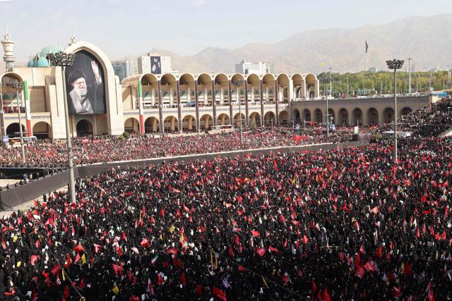 Mourners gather at the Grand Mosalla to pay their final respects to Iran's slain supreme leader Ayatollah Ali Khamenei at the start of his funeral ceremonies in Tehran on July 4, 2026. Funeral ceremonies for Iran's supreme leader Ali Khamenei officially began on July 4, state television reported, an event drawing thousands and intended to serve as a show of strength to the Islamic republic's foes. (Photo by ATTA KENARE / AFP) / 