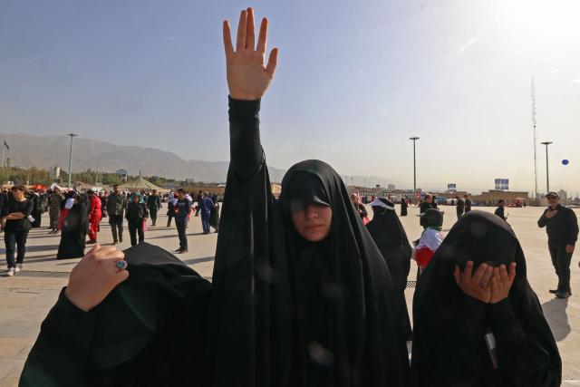 Mourners react upon their arrival at the Grand Mosalla to pay the final respects to Iran's slain supreme leader Ayatollah Ali Khamenei at the start of his funeral ceremonies in Tehran on July 4, 2026. Funeral ceremonies for Iran's supreme leader Ali Khamenei officially began on July 4, state television reported, an event drawing thousands and intended to serve as a show of strength to the Islamic republic's foes. (Photo by ATTA KENARE / AFP) / 