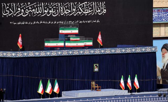 The coffins of Iran's slain supreme leader Ayatollah Ali Khamenei and his family members are pictured at the Grand Mosalla at the start of the funeral ceremonies in Tehran on July 4, 2026. Funeral ceremonies for Iran's supreme leader Ali Khamenei officially began on July 4, state television reported, an event drawing thousands and intended to serve as a show of strength to the Islamic republic's foes. (Photo by ATTA KENARE / AFP) / 