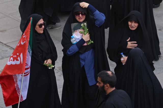 Mourners gather at the Grand Mosalla to pay their final respects to Iran's slain supreme leader Ayatollah Ali Khamenei at the start of his funeral ceremonies in Tehran on July 4, 2026. Funeral ceremonies for Iran's supreme leader Ali Khamenei officially began on July 4, state television reported, an event drawing thousands and intended to serve as a show of strength to the Islamic republic's foes. (Photo by ATTA KENARE / AFP) / 