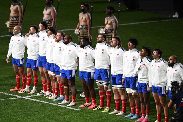 France players observe their national anthem before the start of the rugby Nations Championship match between New Zealand and France at One New Zealand Stadium in Christchurch on July 4, 2026. (Photo by Sanka VIDANAGAMA / AFP)