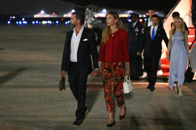 Donald Trump Jr. with his wife Bettina Anderson step off Air Force One upon arrival at Joint Base Andrews in Maryland on July 4, 2026. Trump returned to Washington, DC after attending celebrations on the eve of Independence Day at Mount Rushmore National Memorial in Keystone, South Dakota. (Photo by Mandel NGAN / AFP)