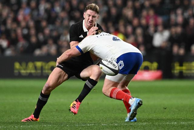 New Zealand's Jordie Barrett (L) is tackled by France's Maxime Lamothe during the rugby Nations Championship match between New Zealand and France at One New Zealand Stadium in Christchurch on July 4, 2026. (Photo by Sanka VIDANAGAMA / AFP)
