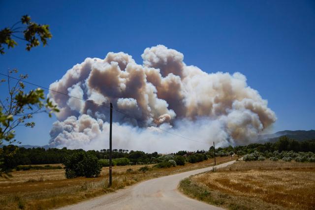 A photograph taken on July 3, 2026 shows smoke rising from a fire burning near La Bisbal de l’Emporda, northeastern Spain on July 3, 2026. (Photo by AFP)