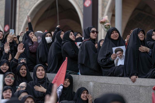 Mourners react as they gather to pay their final respects to Iran's slain supreme leader Ayatollah Ali Khamenei at the start of his funeral ceremonies at the Grand Mosalla in Tehran on July 4, 2026. Mourners beat their chests and chanted "revenge, revenge" as thousands gathered in Tehran early on July 4 for a final farewell to slain supreme leader Ayatollah Ali Khamenei. Khamenei, who ruled Iran for more than three decades, was killed in US-Israeli attacks in late February that sparked a regional war. (Photo by AFP) / 