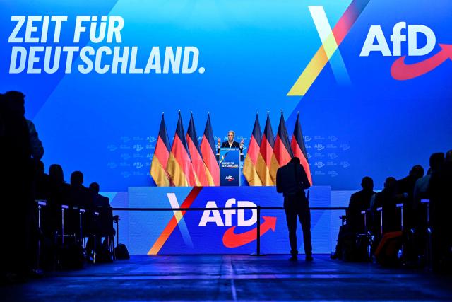 Co-leader of the far-right Alternative for Germany (AfD) party Alice Weidel addresses delegates at the party congress of far-right Alternative for Germany (AfD) at the Messe Erfurt fairground in Erfurt, eastern Germany on July 4, 2026. About 20,000 people flocked to Erfurt, in Thuringia state, according to police, to protest against the Alternative for Germany (AfD) party that tops national opinion polls. (Photo by John MACDOUGALL / AFP)