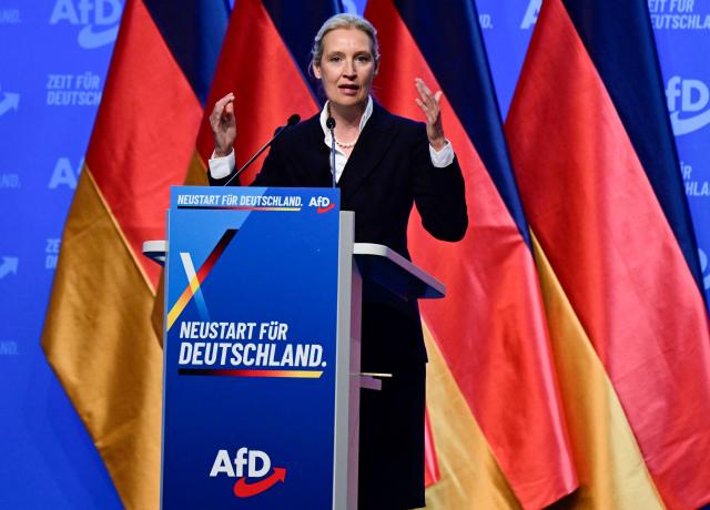 Co-leader of the far-right Alternative for Germany (AfD) party Alice Weidel addresses delegates at the party congress of far-right Alternative for Germany (AfD) at the Messe Erfurt fairground in Erfurt, eastern Germany on July 4, 2026. About 20,000 people flocked to Erfurt, in Thuringia state, according to police, to protest against the Alternative for Germany (AfD) party that tops national opinion polls. (Photo by John MACDOUGALL / AFP)