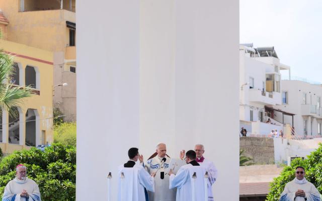 Pope Leo XIV celebrates the mass during a one day visit to Lampedusa island, south of Sicily, on July 4, 2026. Pope Leo XIV bid Europe on July 4 better its response to the "momentous challenge" of migration, urging it to adopt a strategic approach to integrating new arrivals, as well as improving lives in developing countries. (Photo by Tiziana FABI / AFP)