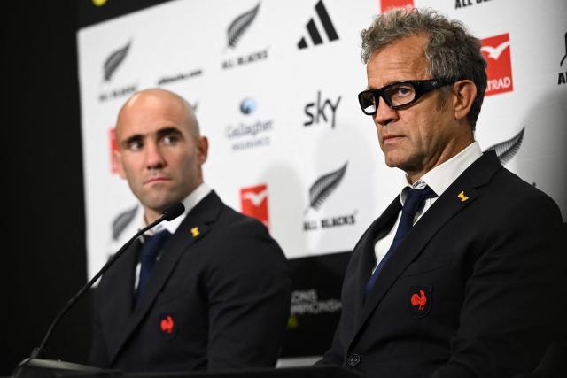 France's head coach Fabien Galthie (R) and Maxime Lucu look on during a press conference after the rugby Nations Championship match between New Zealand and France at One New Zealand Stadium in Christchurch on July 4, 2026. (Photo by Sanka VIDANAGAMA / AFP)