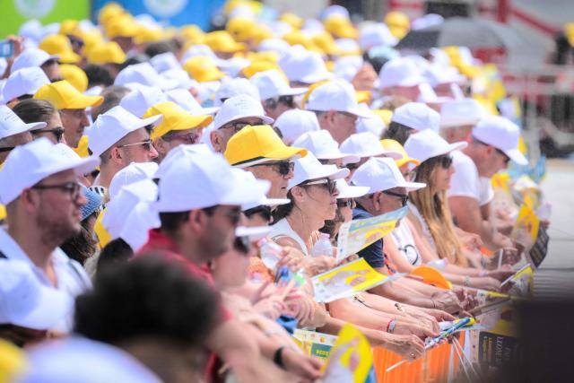 Faithfuls gather to attend the mass celebrated by Pope Leo XIV during a one day visit to Lampedusa island, south of Sicily, on July 4, 2026. Pope Leo XIV bid Europe on July 4 better its response to the "momentous challenge" of migration, urging it to adopt a strategic approach to integrating new arrivals, as well as improving lives in developing countries. (Photo by Tiziana FABI / AFP)
