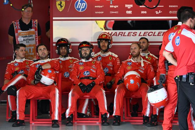 Ferrari mechanics watch the sprint race ahead of the Formula One British Grand Prix at the Silverstone motor racing circuit in Silverstone, central England, on July 4, 2026. (Photo by PETER POWELL / POOL / AFP)