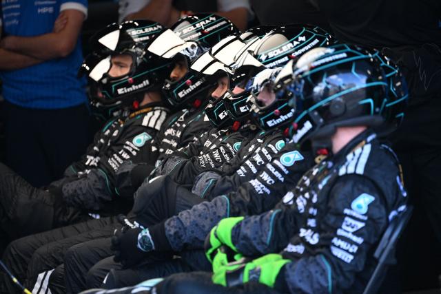 Mercedes mechanics watch the sprint race ahead of the Formula One British Grand Prix at the Silverstone motor racing circuit in Silverstone, central England, on July 4, 2026. (Photo by PETER POWELL / POOL / AFP)