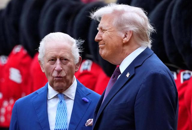 (FILES) US President Donald Trump (R) and Britain's King Charles III inspect a Guard of Honour during a ceremonial welcome in the Quadrangle at Windsor Castle in Windsor on September 17, 2025, during the US president's second state visit. Britain's King Charles III on July 4, 2026 said the US and UK would continue to defend "shared values", in a message to US President Donald Trump and the American people on the country's 250th independence anniversary. (Photo by Kirsty Wigglesworth / POOL / AFP)