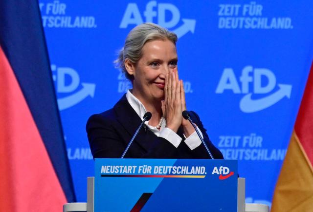 Co-leader of the far-right Alternative for Germany (AfD) party Alice Weidel acknowledges applaud by the delegates after delivering a speech at the party congress of far-right Alternative for Germany (AfD) at the Messe Erfurt fairground in Erfurt, eastern Germany on July 4, 2026. About 20,000 people flocked to Erfurt, in Thuringia state, according to police, to protest against the Alternative for Germany (AfD) party that tops national opinion polls. (Photo by John MACDOUGALL / AFP)