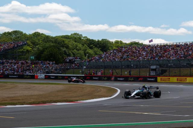 Mercedes' Italian driver Kimi Antonelli leads Ferrari's British driver Lewis Hamilton during the sprint race ahead of the Formula One British Grand Prix at the Silverstone motor racing circuit in Silverstone, central England, on July 4, 2026. (Photo by Andrej ISAKOVIC / AFP)