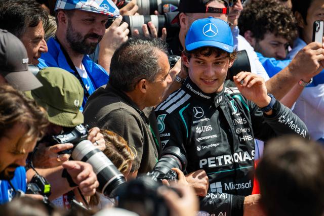 Mercedes' Italian driver Kimi Antonelli speak with his father Marco  after winning the sprint race ahead of the Formula One British Grand Prix at the Silverstone motor racing circuit in Silverstone, central England, on July 4, 2026. (Photo by Ben STANSALL / AFP)