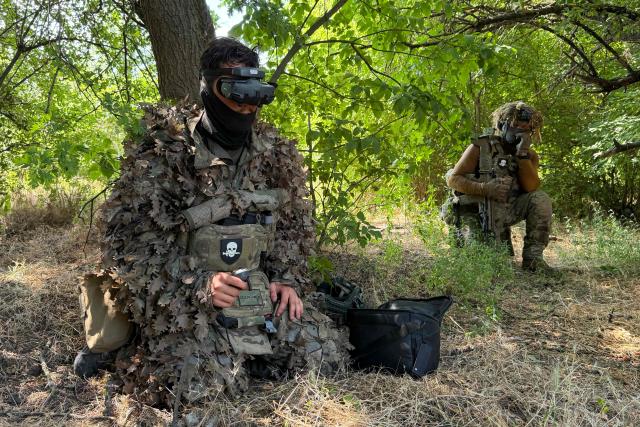 French volunteer members from the Revanche Tactical Group, which operates under the International Legion of the Defence Intelligence of Ukraine, take part in a military training at an undisclosed location, in the Zaporizhzhia region, on July 3, 2026, amid the Russian invasion of Ukraine. (Photo by Darya NAZAROVA / AFP)