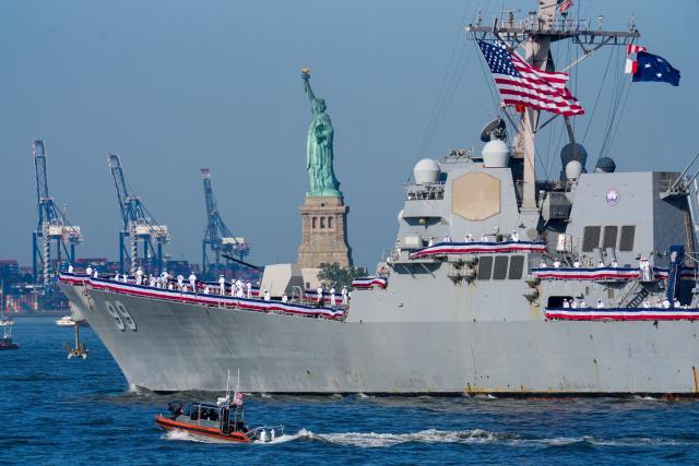 US Navy destroyer USS Farragut (DDG-99) sails by the Statue of Liberty ahead of the "Sail250" ships gathering event, which takes place in the Upper New York Bay and four other ports as the United States celebrates its 250th anniversary on Independence Day, in New York City on July 4, 2026. Millions of Americans celebrate the country's 250th birthday on July 4, 2026, as the landmark celebration comes at a time of deep political division, with a president determined to put his stamp on the festivities. (Photo by Ryan MURPHY / AFP)