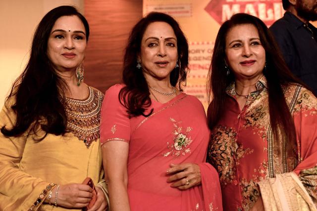 Bollywood actress Hema Malini (C) poses with fellow actors Padmini Kolhapure (L) and Poonam Dhillon during a press conference in Mumbai on July 4, 2026, ahead of the Dream Girl's Diamond Jubilee concert celebrating her 60 years in Indian cinema. (Photo by Sujit JAISWAL / AFP)