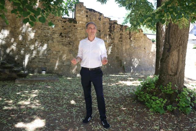 French politician, centre-left party Place publique's leader and MEP Raphael Glucksmann poses as he arrives to take part in the 6th edition of Le Festival des Idées ("Ideas' Festival") in La Charité-sur-Loire, central France on July 4, 2026. From July 3 to 5, 2026, the festival hosts around forty prominent guests from various backgrounds for a series of debates aiming "to discuss the major challenges facing society and explore constructive solutions for the future" of France. (Photo by ALAIN JOCARD / AFP)
