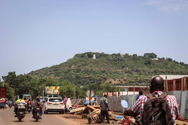 A general view shows traffic moving along a main road in Bamako on July 4, 2026. Jihadists and their separatist Tuareg allies hit Mali with fresh coordinated attacks on July 4, 2026, striking multiple towns and a prison just months after hobbling the country's military junta with a similar wave of assaults. (Photo by AFP)