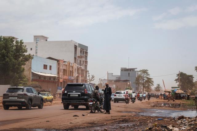 A general view shows traffic moving along a main road in Bamako on July 4, 2026. Jihadists and their separatist Tuareg allies hit Mali with fresh coordinated attacks on July 4, 2026, striking multiple towns and a prison just months after hobbling the country's military junta with a similar wave of assaults. (Photo by AFP)