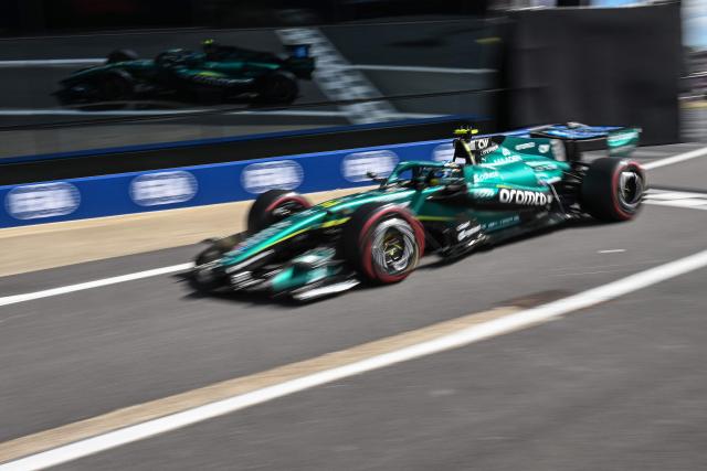 Aston Martin's Spanish driver Fernando Alonso drives down pit lane during the qualifying session ahead of the Formula One British Grand Prix at the Silverstone motor racing circuit in Silverstone, central England, on July 4, 2026. (Photo by PETER POWELL / POOL / AFP)