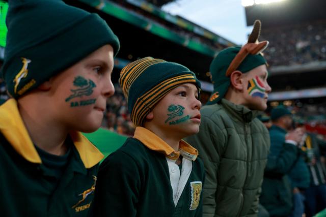 Young South African supporters sport flags painted on their cheecks during the warm up ahead of the rugby Nations Championship match between South Africa and England at Ellis Park Stadium in Johannesburg on July 4, 2026. (Photo by PHILL MAGAKOE / AFP)